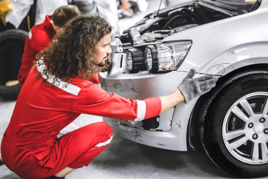 Mechanic carrying out car body repairs Newcastle after accident damage